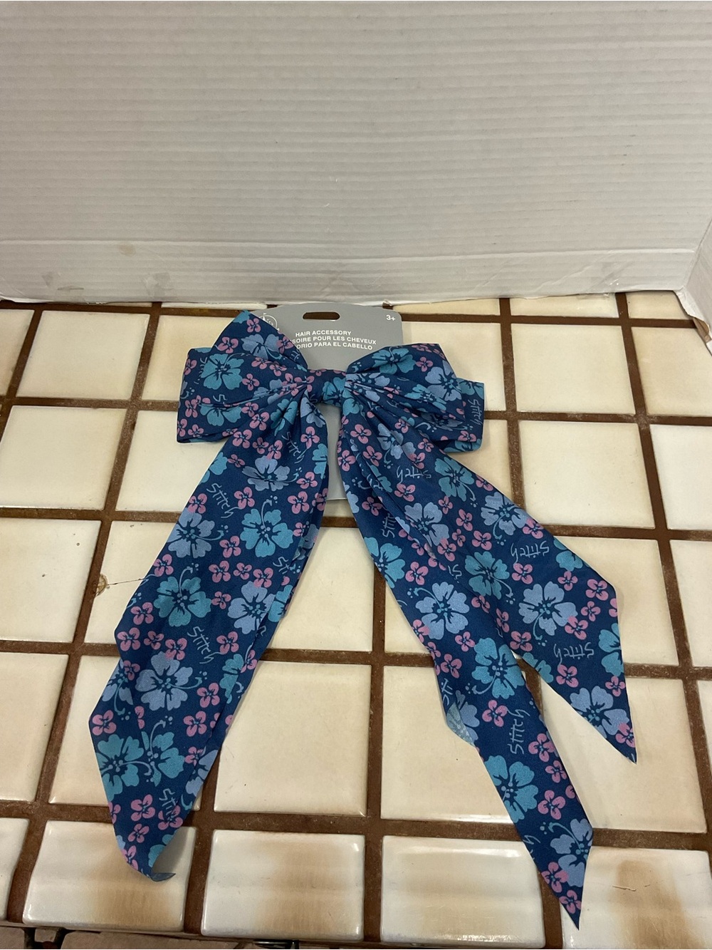 Disney Stitch Floral Bow Hair Accessory with Blue and Pink Flowers